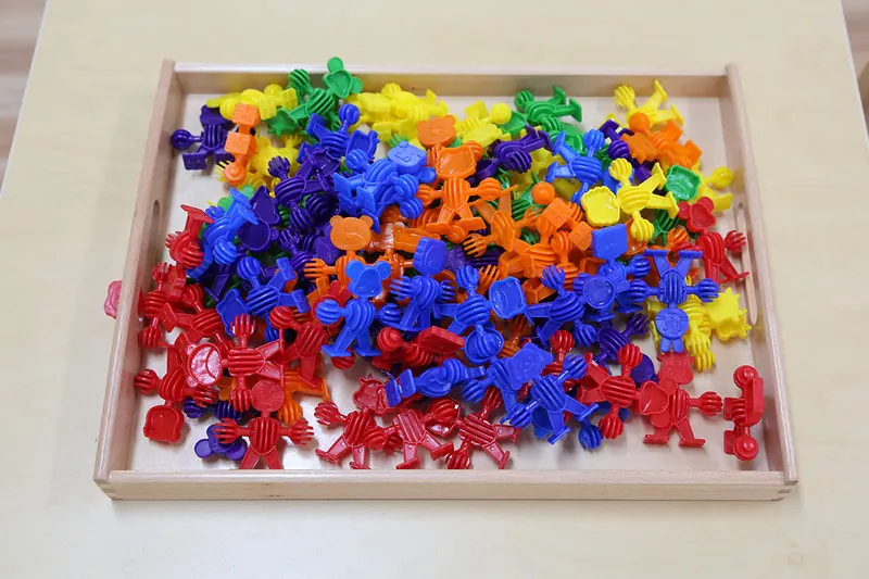 Tray of bright linking counters used for sorting and counting