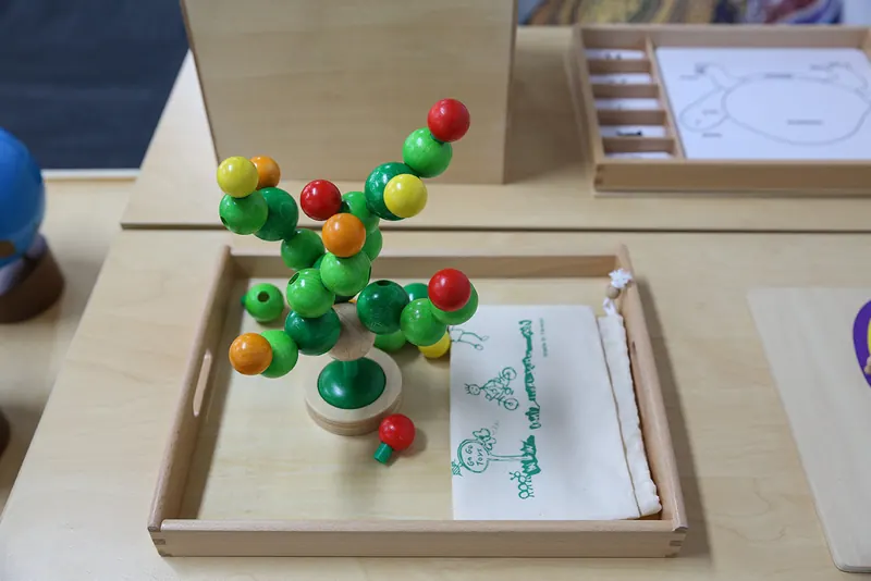 Wooden bead tree that builds fine motor control and concentration