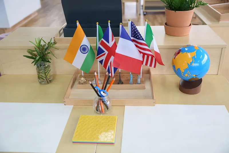 World flags and a continent globe from the Montessori culture area