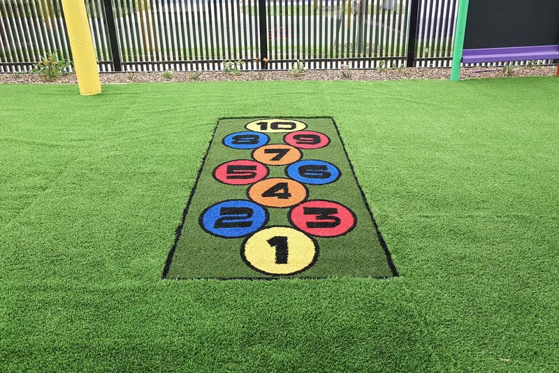 Number hopscotch set into the playground lawn