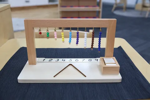 Montessori coloured bead hanger for learning numbers one to nine
