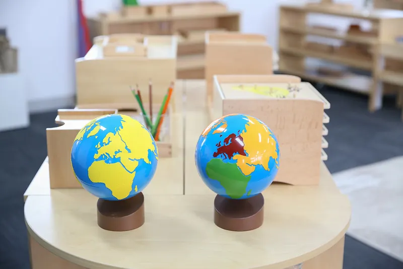 Montessori sandpaper globe and coloured continent globe