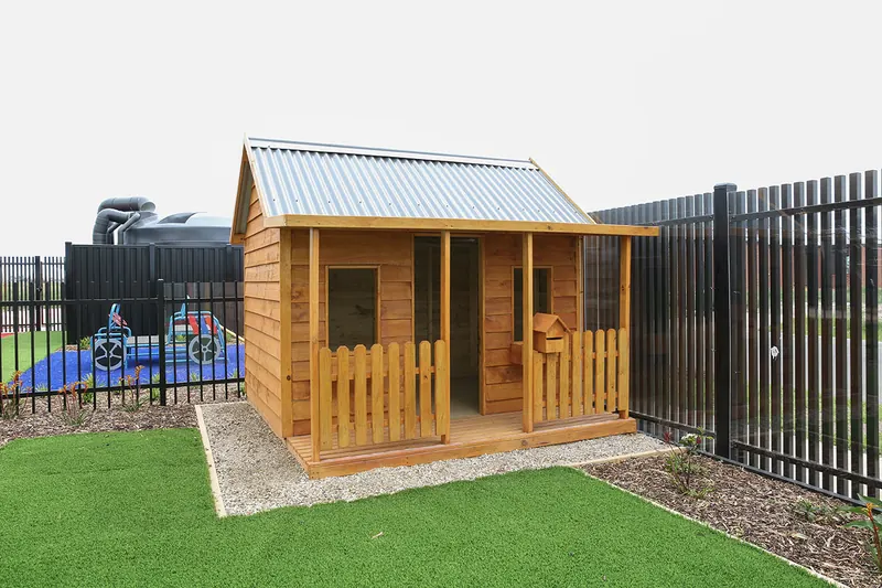 Timber cubby house in the outdoor play area